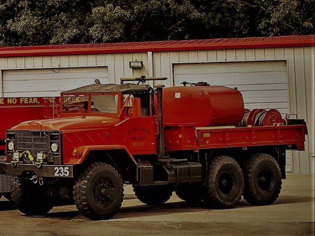 Brush 235, a six-wheel-drive brush truck with a tank on the back. Photo posted by Crains Creek Fire-Rescue.